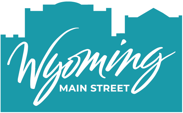 Wyoming Main Street Primary Logo in Teal with building outlines behind text