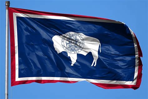 Wyoming flag with blue sky background